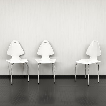 three white chairs at a wall with space for your content