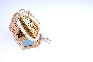 Ramadan / Eid lantern isolated. Arabic decoration lamp on white background. Selective focus and crop fragment