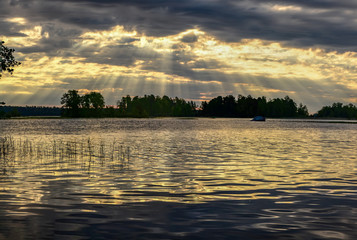 Obraz premium Summer dawn on lake Vuoksa in the Leningrad region. Priozersky district, the island of bad Luck located on lake Vuoksa.