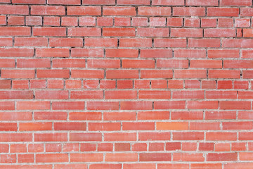 red brick wall is folded very badly