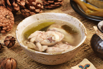 Peeled chili pepper chicken soup on the table 