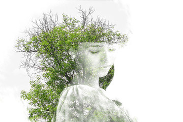 Double exposure of young beautiful girl among the leaves and trees. Portrait of attractive lady...
