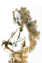 Double exposure of young beautiful girl among the leaves and trees. Portrait of attractive lady combined with photograph of tree. Creative. Effect of double exposure, nature style. Silhouette Isolated