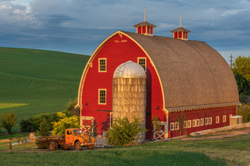 Red barn and orange truck in Palouse Washington © Chris
