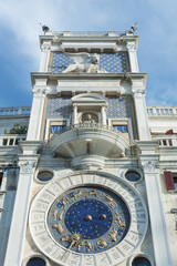 Zodiac clock. Clock Tower with winged lion and two moors striking the bell - early Renaissance (1497) building in Venice, located the north side of Piazza San Marco, Italy, Europe.