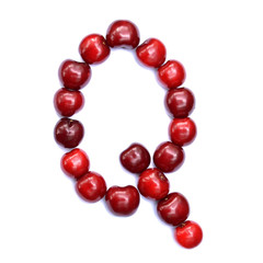 Letter Q made with cherries to form a letter of the alphabet. Berry letters on a white background.
