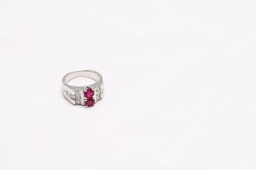 Pink gem stone on diamond ring