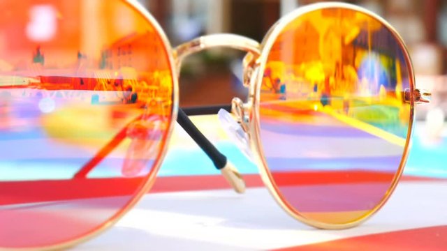 Sunglasses. Pool reflection. Concept of holiday at sea. Observations children, play. TimeLapse.