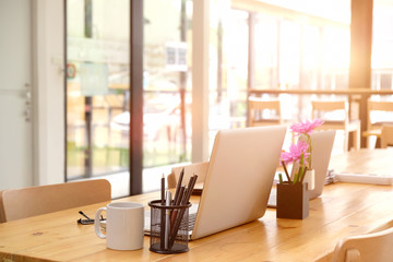 Workspace at office. Mockup laptop computer on office desk.