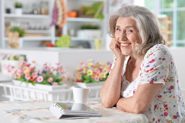  woman  using digital tablet
