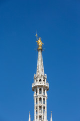 Fototapeta na wymiar Milan, Madonnina and Cathedral, blue sky. Lombardia, Italy