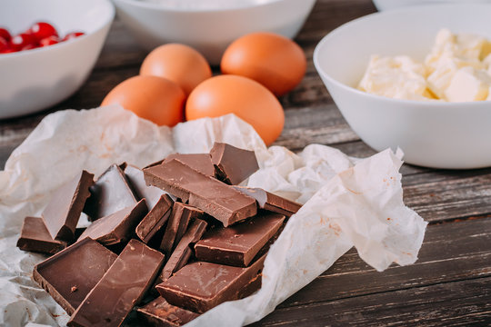 Ingredients for chocolate brauni with cherries on wooden background