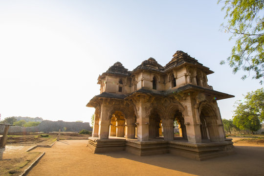 ancient pagoda from ruins of Hampi temple complex in karnataka with blue sky