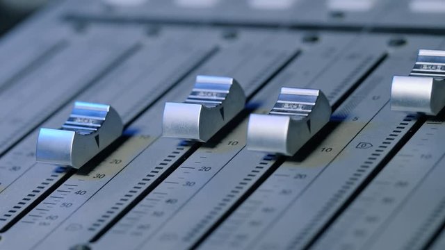 Professional Recording Studio. Interface of sound equipment for mixing music. Fader. Different modes of audio console. Process of working on song or voice. 4k