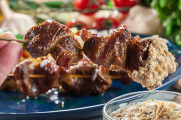Traditional pork satay with peanut sauce and vegetables