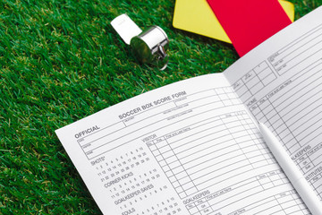 two penalty cards and a whistle for the referee