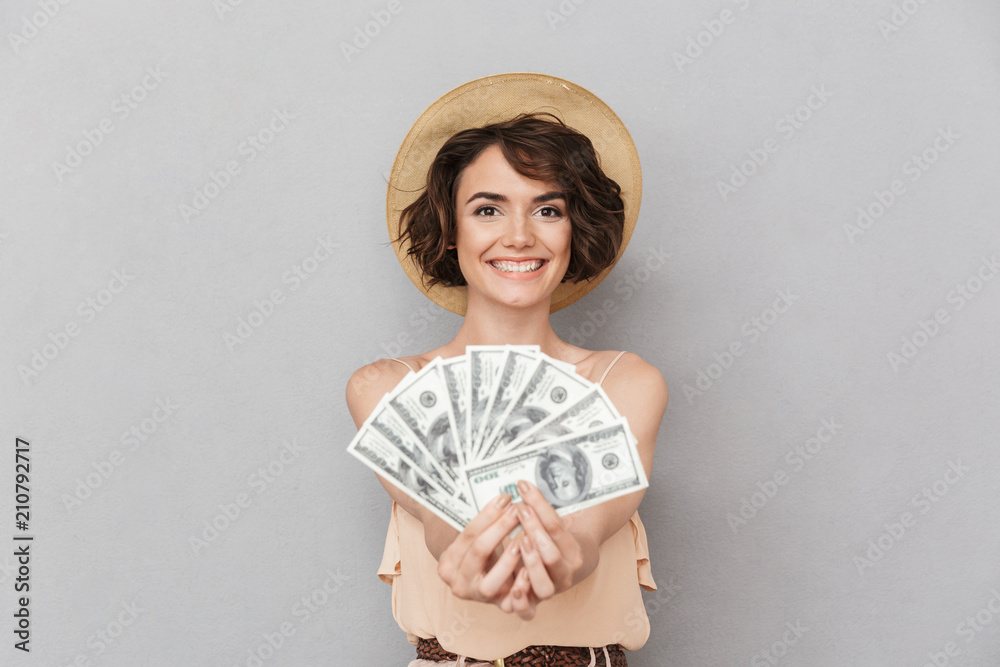 Poster Portrait of a happy young woman in summer hat