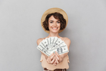 Portrait of a happy young woman in summer hat