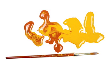 Spilled brown watercolor with paintbrush isolated on white background, top view