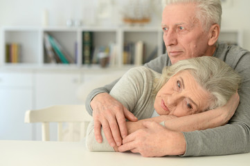 Sad Senior couple at home 