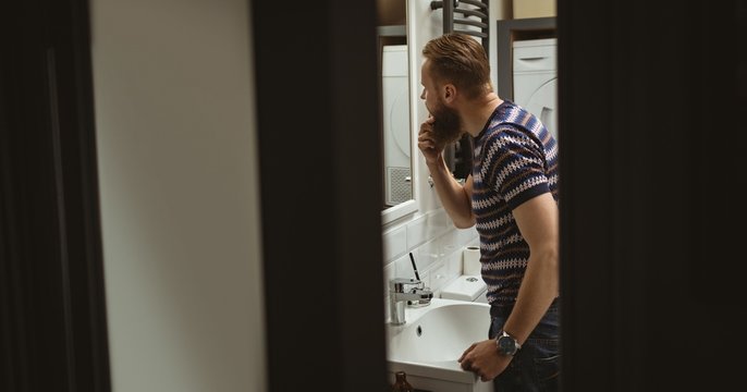 Man checking out himself in mirror