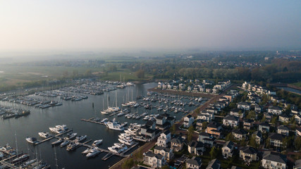Aerial view of beautiful modern luxury yachts in the sea port. P
