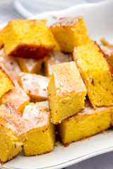Traditional Moldovan and Romanian sweet corn cake of Malay with glaze at the festival of national traditions in Moldova.