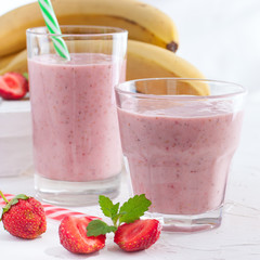 Strawberry and banana smoothie in the jar,square