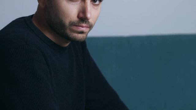man with mental disorders is about to explode with rage looking at the camera