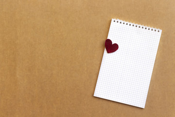 Blank notebook with wooden red  hearts. Copy space, top view. Valentines day background