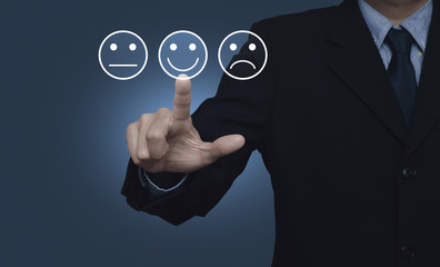 Businessman pressing excellent smiley face rating icon over gradient light blue background, Business customer service evaluation and feedback rating concept