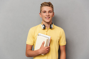 Portrait of a smiling teenage boy with headphones