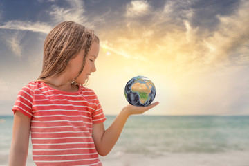 girl holding earth