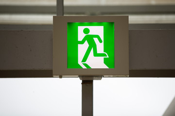 green emergency exit sign.