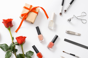 Manicure set and nail polish on wooden background