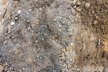 Close-up of construction soil with pebbles and clay