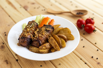 Meat rolls with a garnish of potatoes