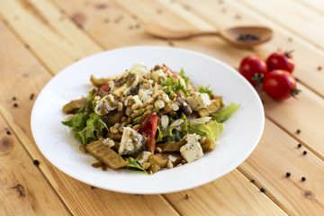Salad with cheese dor blu and cedar nuts