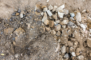 Close-up of construction soil with pebbles and clay