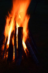 Bonfire burning bright in dark at midsummer night.