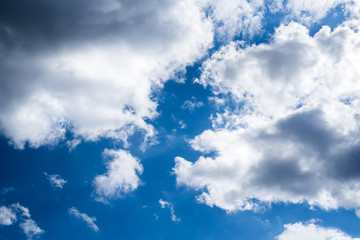 Big and heavy clouds on blue sky background