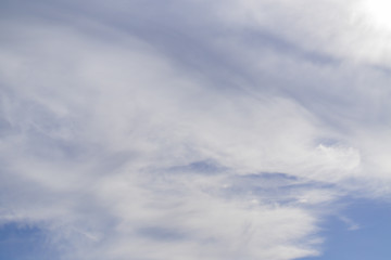 blye sky with white fluffy clouds background