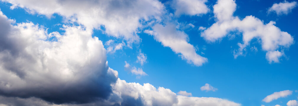 Big and heavy clouds on blue sky background