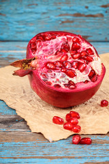Pomegranate fruit on the a wooden boards
