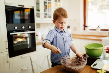 Cute child learning to become a chef
