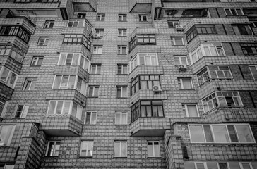 Soviet apartment building. Apartment block. Residential building. Soviet architectural style. 1980s. Black and white photo. Ust-Kamenogorsk (Kazakhstan)