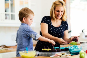 Mother and child preparing cookies