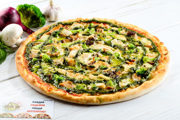 Delicious homemade Italian pizza with mushrooms and broccoli on 