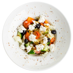 Appetizing vegetarian salad with feta cheese, tomatoes, cucumber