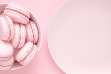 Pink macaroons on a pink background. Sweet background. Flat lay, top view, copy space 